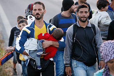Refugees make their way toward the Greek-Macedonia border. Photo by Matthieu Alexandre/Caritas Internationalis