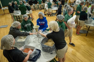 Helping Hands event at Father Lopez Catholic High School in Daytona Beach, Florida. Students packed 20,000 meals over an extended lunch break. The packaged meals will be sent through Helping Hands, the joint program between CRS and Stop Hunger Now, to feed the hungry in Burkina Faso.  Photo by Karen Kasmauski for Catholic Relief Services, used with permission