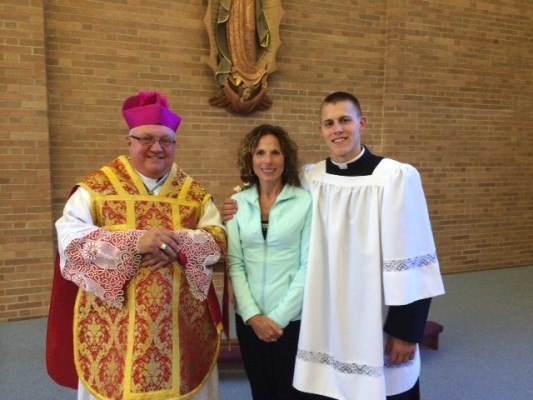 Bishop Robert Morlino, Kathi Klaas, and Phil Klaas in the oratory of the Diocese of Madison's Bishop O'Connor's Center