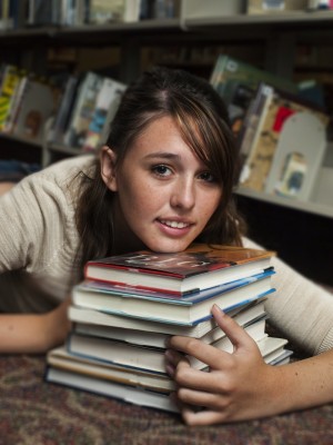 Teen at the Library by Arina Habich via Dollar Photo Club