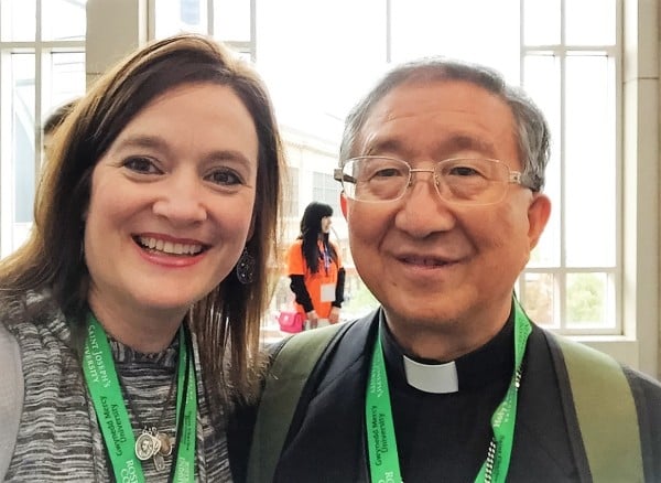 Roxane and Archbishop Hee-joong Kim hang out near the escalator at the Philadelphia Convention Center, Sept. 2015. Copyright 2015 Roxane Salonen. All rights reserved.