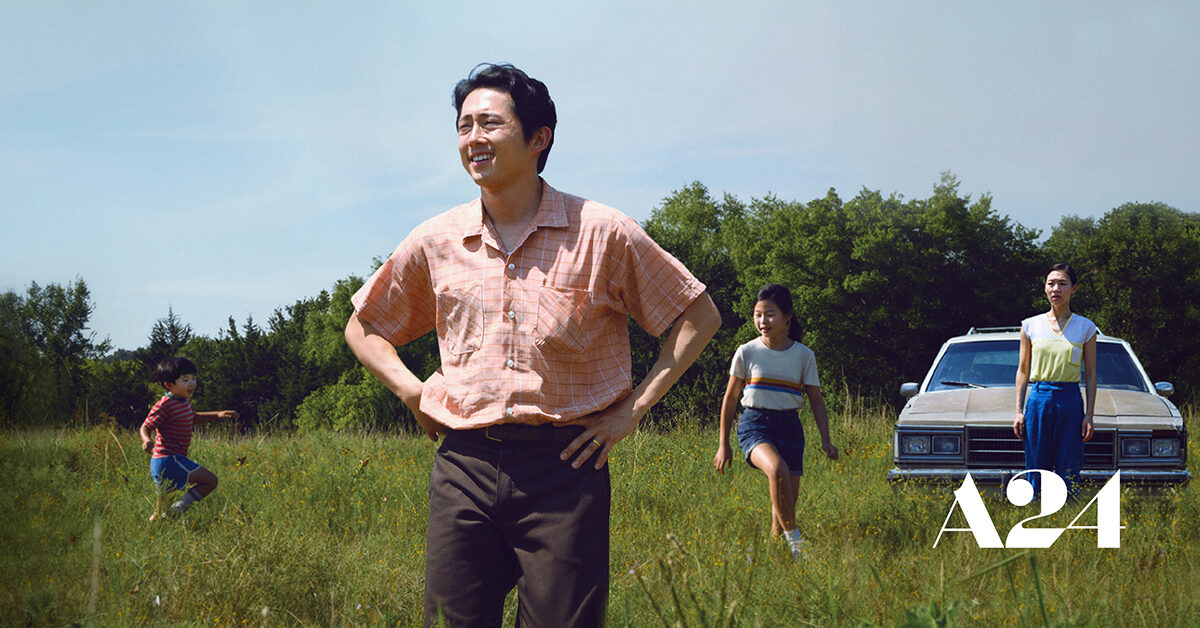 Asian family on a farm with car in background