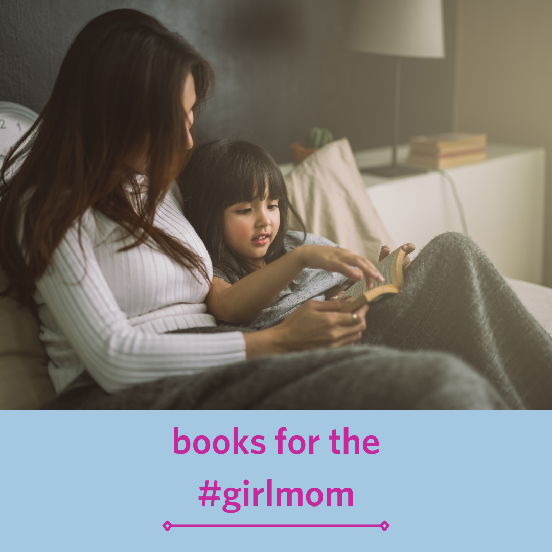 little girl reading a book with her mom